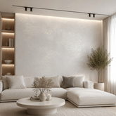 Minimalist living room featuring an accent wall finished in Moonlight in pearl white with a subtle silver shimmer. 