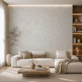 Bright, airy living room with an accent wall finished in Moonlight in soft off-white with a fine gold botanical shimmer.