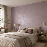 Soft bedroom with an accent wall finished in Moonlight in muted lilac with a silver metallic sheen. 