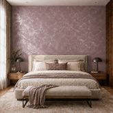 Sophisticated bedroom with an accent wall finished in Moonlight in deep mauve with an intense silver metallic pattern.